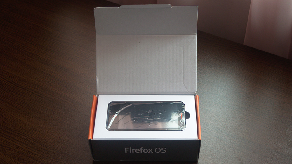 The box unwrapped showing the front of the Flame phone